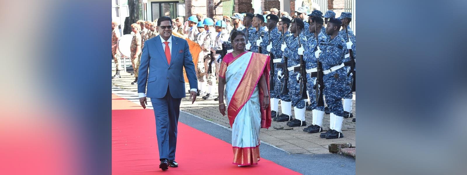 President Smt. Droupadi Murmu received a warm welcome from H.E. Mr. Chandrikapersad Santokhi, President of Suriname at the Presidential palace in Paramaribo, Suriname